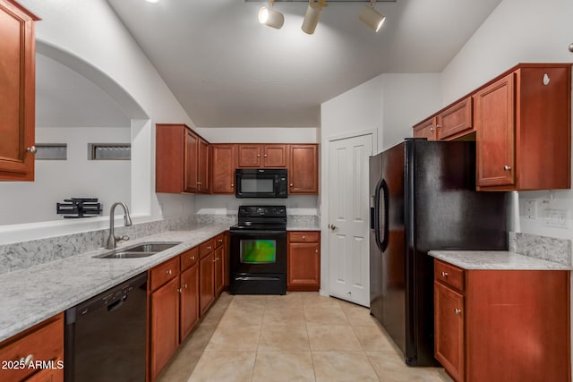 12132 W Caribbean Ln, El Mirage, AZ 85335 - kitchen featuring black appliances, light tile patterned floors, light stone countertops, and brown cabinets
