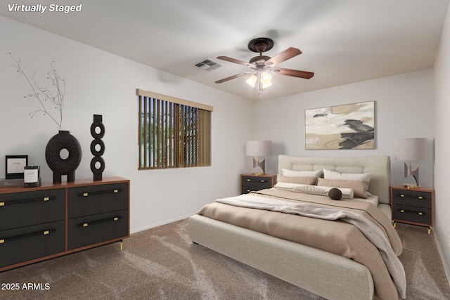 12132 W Caribbean Ln, El Mirage, AZ 85335 - bedroom with dark colored carpet and ceiling fan