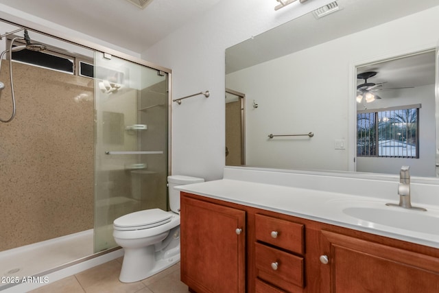 12132 W Caribbean Ln, El Mirage, AZ 85335 - bathroom featuring a stall shower, vanity, tile patterned flooring, and a ceiling fan