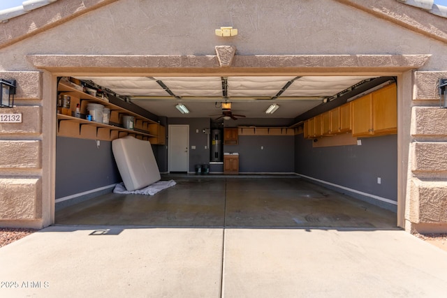 12132 W Caribbean Ln, El Mirage, AZ 85335 - garage featuring water heater, a garage door opener, and concrete driveway