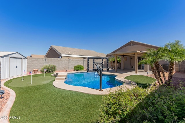 12132 W Caribbean Ln, El Mirage, AZ 85335 - view of swimming pool with a shed, a fenced backyard, a patio, and a putting area