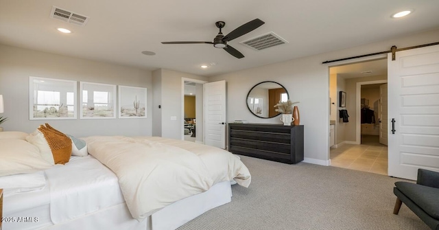 12712 W Corona Ave, Avondale, AZ 85323 - bedroom with a barn door, recessed lighting, light carpet, ceiling fan, and baseboards