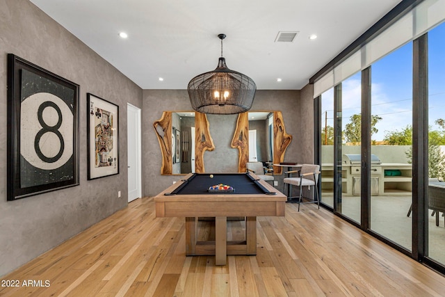 playroom with billiards and light hardwood / wood-style flooring