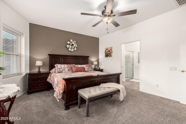 bedroom featuring ceiling fan, ensuite bathroom, and carpet flooring