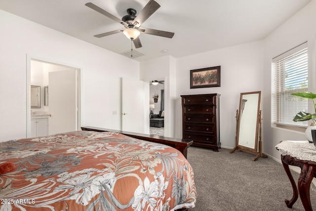 bedroom featuring ceiling fan, connected bathroom, and carpet flooring