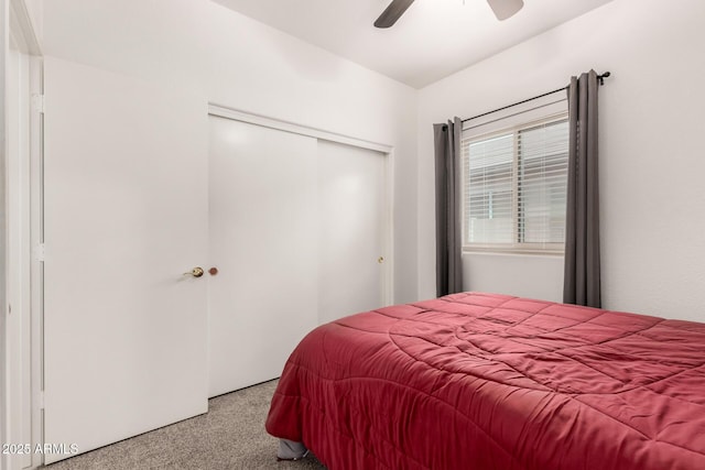 bedroom with carpet, ceiling fan, and a closet