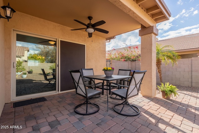 view of patio featuring ceiling fan