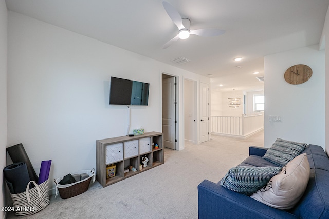 living room featuring ceiling fan and carpet flooring