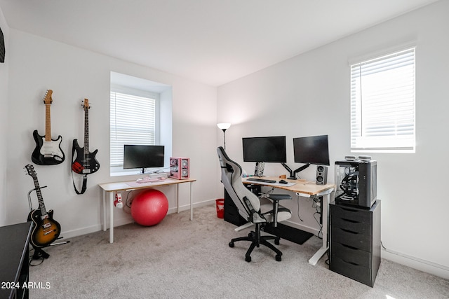 carpeted home office with plenty of natural light