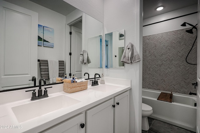 full bathroom with tile patterned floors, tiled shower / bath, vanity, and toilet