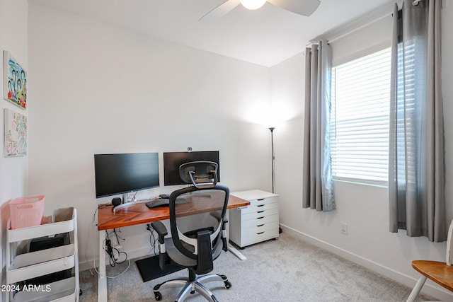 office area featuring ceiling fan and light carpet