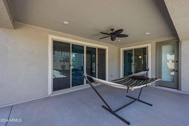 view of patio featuring ceiling fan