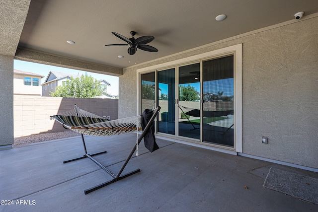 view of patio featuring ceiling fan