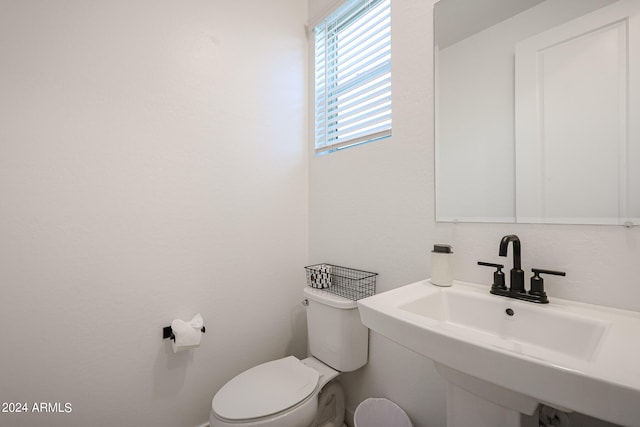 bathroom featuring toilet and sink