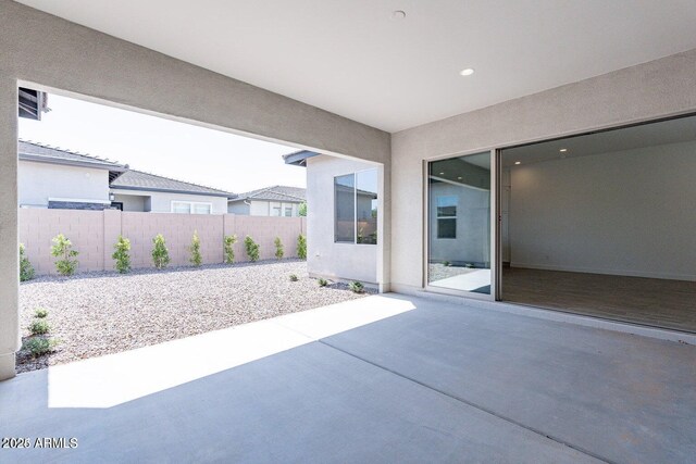 view of patio / terrace featuring fence