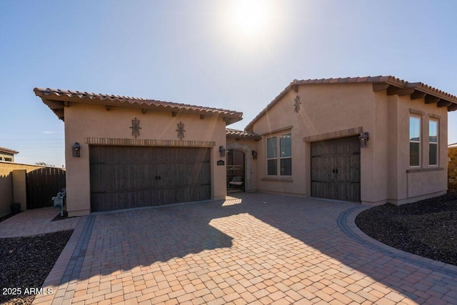 mediterranean / spanish house featuring a garage