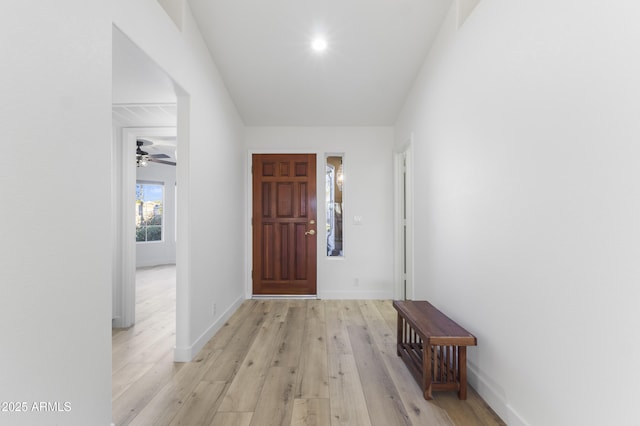 entryway with ceiling fan and light hardwood / wood-style flooring