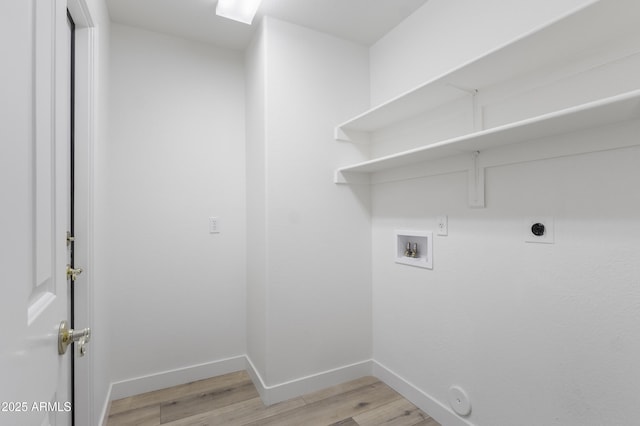 laundry room featuring hookup for an electric dryer, gas dryer hookup, light hardwood / wood-style flooring, and washer hookup