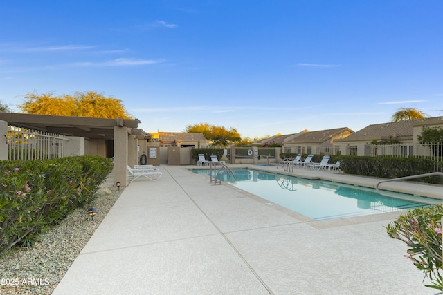 view of swimming pool with a patio