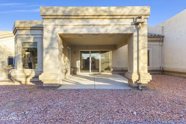 rear view of property featuring a patio area