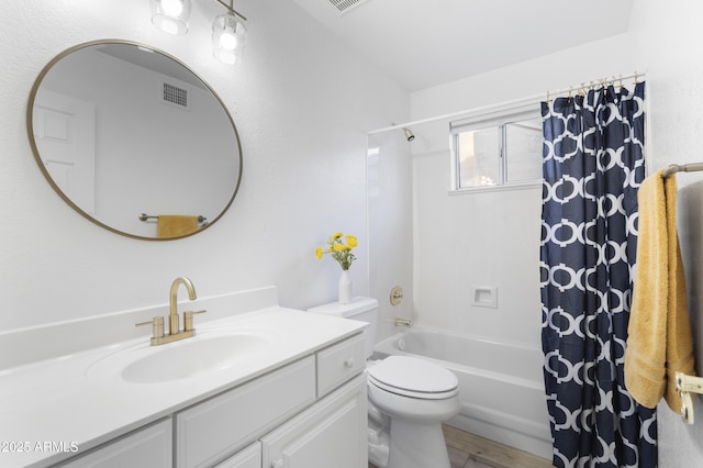 full bathroom featuring shower / bath combination with curtain, vanity, and toilet