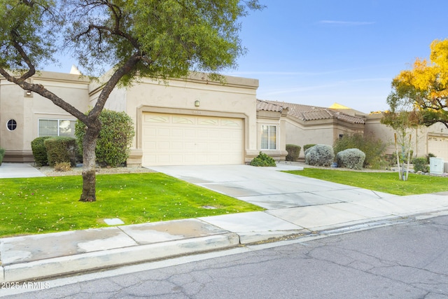 mediterranean / spanish-style house with a garage and a front yard