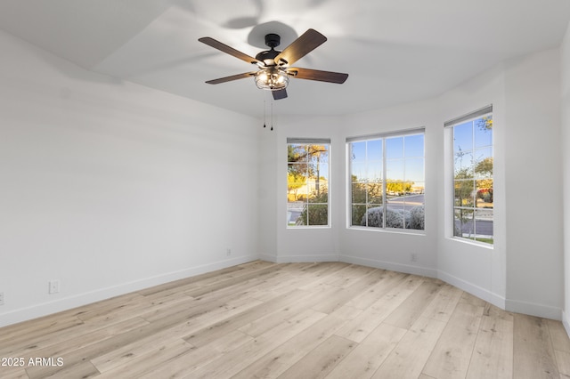 unfurnished room with light hardwood / wood-style floors and ceiling fan