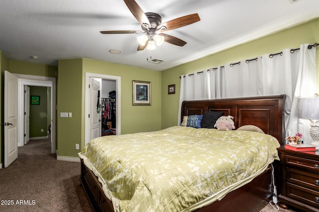 33602 N Cobble Stone Dr, San Tan Valley, AZ 85143 - bedroom featuring dark colored carpet, a spacious closet, baseboards, a closet, and ceiling fan
