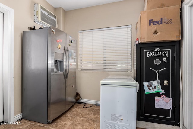 33602 N Cobble Stone Dr, San Tan Valley, AZ 85143 - kitchen with stainless steel fridge, a wall mounted AC, and baseboards