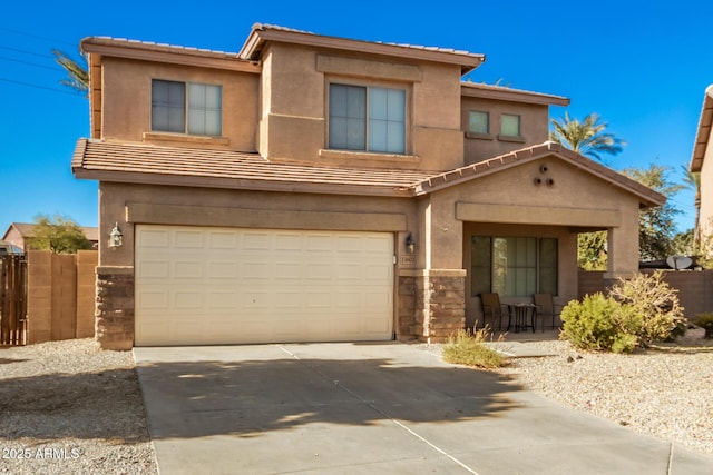 33602 N Cobble Stone Dr, San Tan Valley, AZ 85143 - view of front facade featuring stone siding, an attached garage, a tiled roof, driveway, and stucco siding