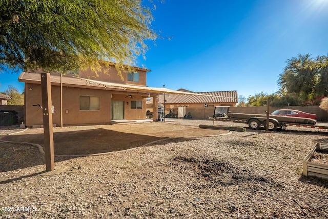 33602 N Cobble Stone Dr, San Tan Valley, AZ 85143 - back of property with stucco siding, fence, and a patio