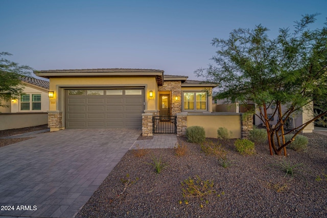 prairie-style home featuring a garage