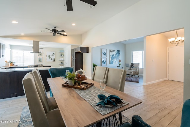 dining room featuring ceiling fan with notable chandelier, recessed lighting, baseboards, wood tiled floor, and vaulted ceiling