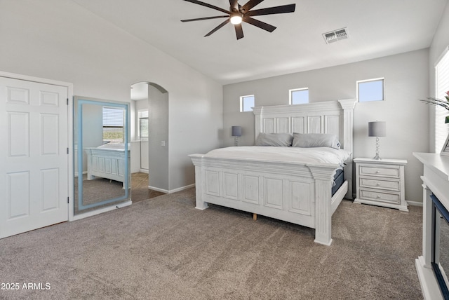 4418 W Yoosooni Dr, New River, AZ 85087 - carpeted bedroom with arched walkways, lofted ceiling, and a ceiling fan