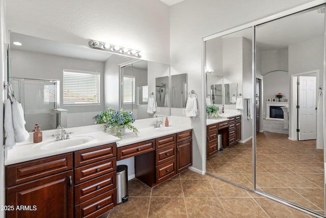 4418 W Yoosooni Dr, New River, AZ 85087 - full bathroom with double vanity, a shower stall, and tile patterned floors