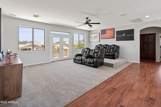 4418 W Yoosooni Dr, New River, AZ 85087 - living room featuring arched walkways, ceiling fan, wood finished floors, french doors, and recessed lighting
