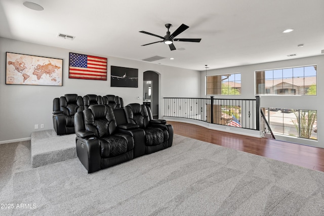 4418 W Yoosooni Dr, New River, AZ 85087 - home theater with carpet flooring, a ceiling fan, arched walkways, and recessed lighting