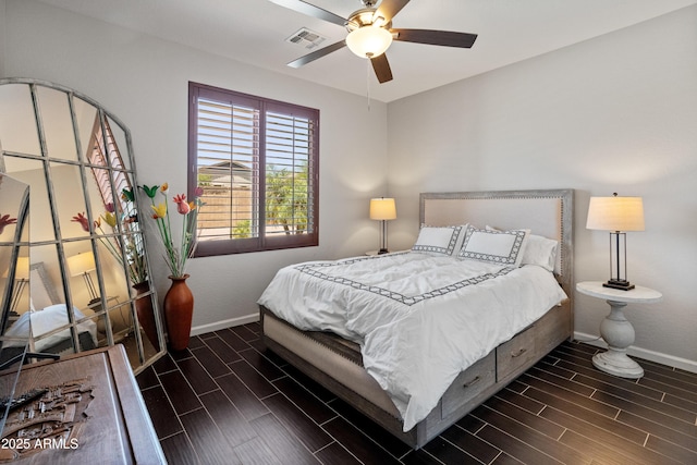 4418 W Yoosooni Dr, New River, AZ 85087 - bedroom with wood tiled floors and a ceiling fan