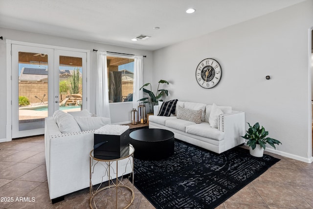 4418 W Yoosooni Dr, New River, AZ 85087 - tiled living area with recessed lighting and french doors