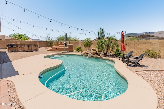 4418 W Yoosooni Dr, New River, AZ 85087 - view of swimming pool featuring a fenced backyard and a patio area