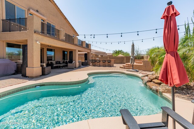 4418 W Yoosooni Dr, New River, AZ 85087 - view of pool with an outdoor living space and a patio area