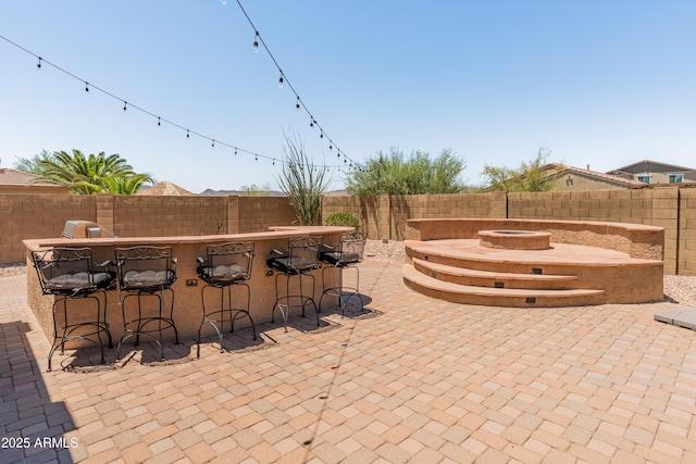 4418 W Yoosooni Dr, New River, AZ 85087 - fenced backyard featuring an outdoor fire pit and a patio