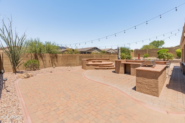 4418 W Yoosooni Dr, New River, AZ 85087 - fenced backyard featuring a patio and area for grilling