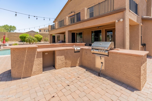 4418 W Yoosooni Dr, New River, AZ 85087 - patio / terrace with an outdoor kitchen and a patio