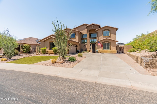 4418 W Yoosooni Dr, New River, AZ 85087 - mediterranean / spanish-style home with stucco siding, concrete driveway, and an attached garage