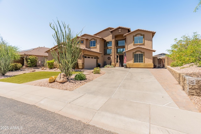 4418 W Yoosooni Dr, New River, AZ 85087 - mediterranean / spanish-style home with stucco siding, driveway, and an attached garage