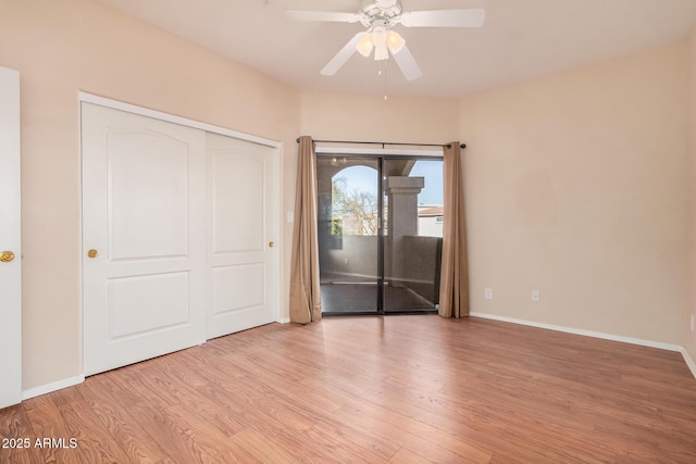 unfurnished bedroom with ceiling fan, access to exterior, light hardwood / wood-style floors, and a closet