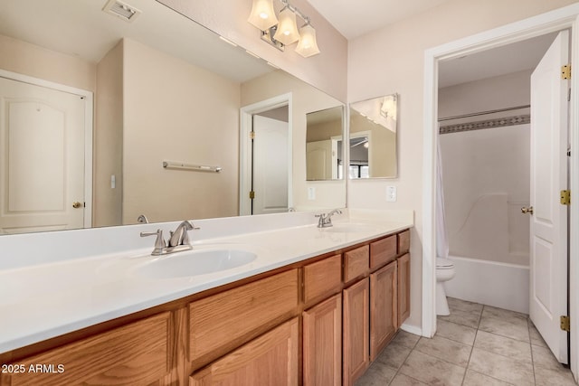 full bathroom featuring shower / bathing tub combination, vanity, tile patterned floors, and toilet