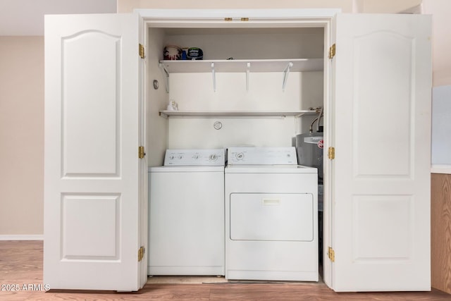 laundry room with light wood-type flooring and independent washer and dryer