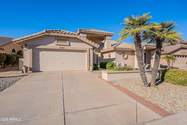 mediterranean / spanish-style home with a garage